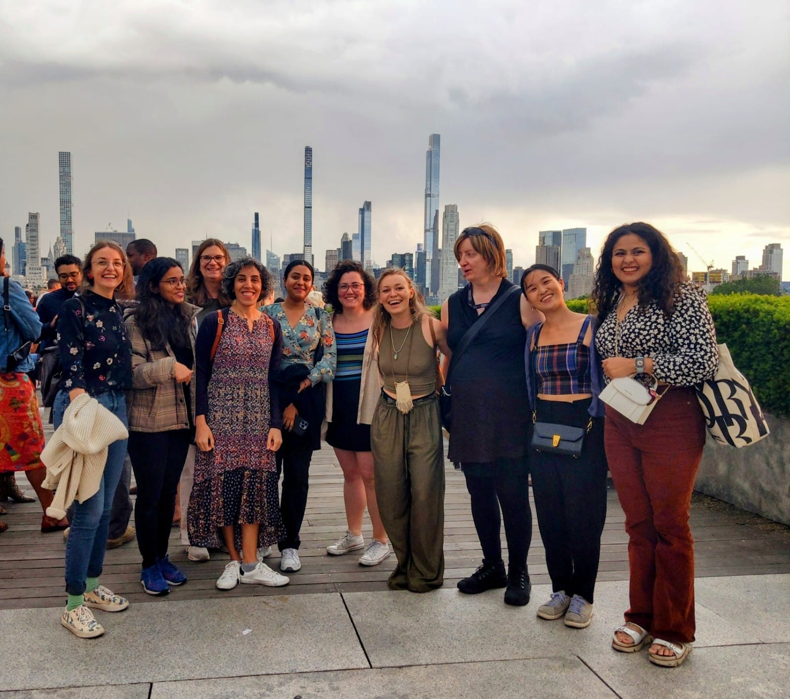 10 NYC Women in STEM members with the NYC skyline